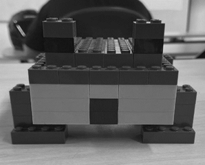 A green and yellow building blocks

Description automatically generated with low confidence