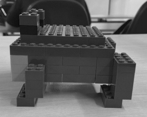 A picture containing LEGO, toy, scale model, toy block

Description automatically generated